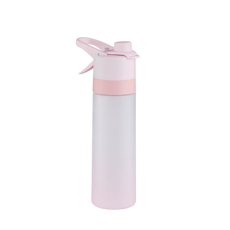 Spray water bottle mechanism showing dual drinking and misting functions